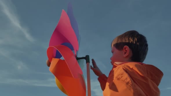 Preschooler kid play with pinwheel in sunset, Lifestyle Stock Footage ...
