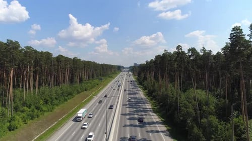 Aerial shot summer road with lots of cars with cars in forest 01