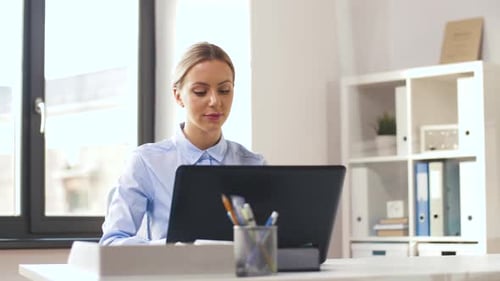 Businesswoman with Laptop Working at Office 19
