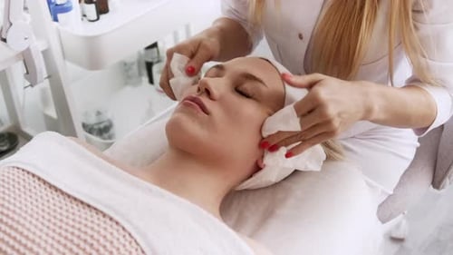 Woman Receiving Relaxing Facial at Medical Spa