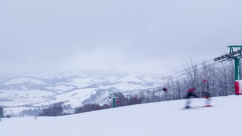 Ski Lifts on the Background of Snowcapped Mountains and a Mountain Glacier