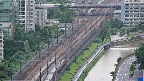 time lapse of traffic bridge with car, train, and people in Shenzhen, China
