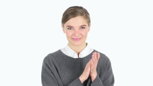 Smiling Woman Clapping Against a White Background