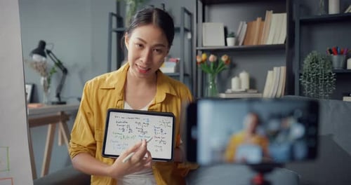 Woman Explaining Math Formulas on Video at Home