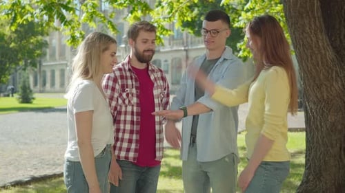 Friends Celebrate Teamwork and Success on Campus