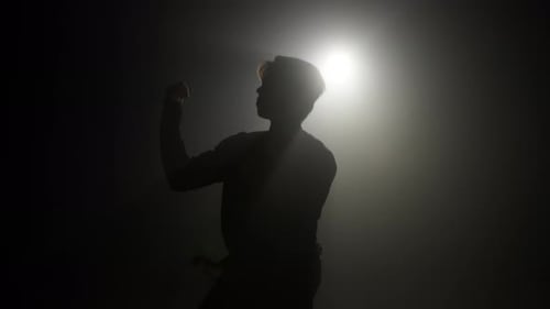 Talented Teenager Man Dancing Contemporary on Dark Background in Studio