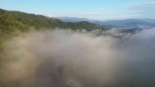 Flying above the river and fog