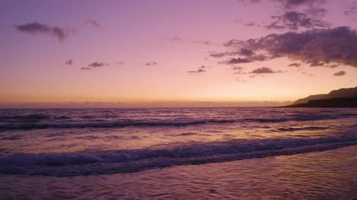 Aerial Drone view of beautiful Purple Sunrise over the Calm Ocean in Bali, Indonesia.