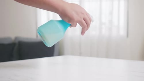 Hand Disinfecting White Table with Spray and Cloth