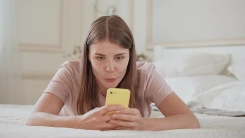 Female Messaging Use Mobile in Apartment