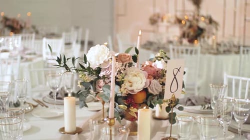 Elegant Wedding Reception Table Setting with Floral Decor