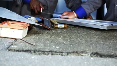 Workers Assemble Aluminum Frame in Workshop