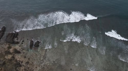 Waves crashing beach