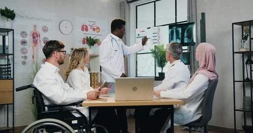 Medical Staff Meeting at Modern Hospital Office