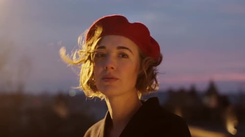 Beautiful Woman in Beret Smiles During Sunrise