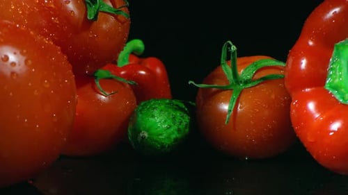 Fresh Vegetables with Water Droplets on Black Background