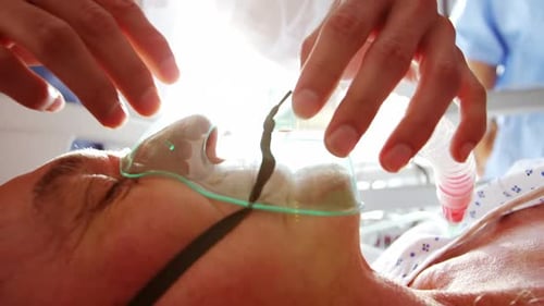 Hospital Patient Receiving Oxygen Therapy with Mask