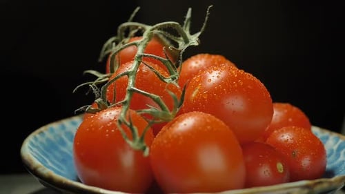Vibrant Red Tomatoes on the Vine in Bowl
