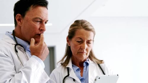 Doctors using digital tablet
