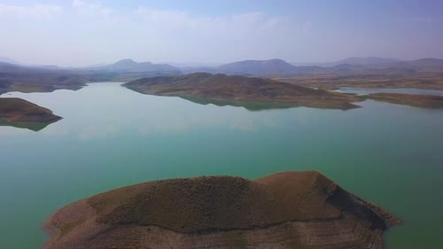 A very big and beautiful lake with lots of small islands in it.