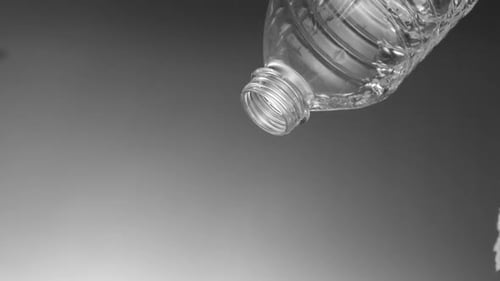 Pouring water out of plastic bottle, Slow Motion