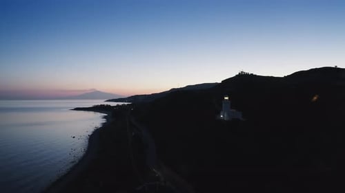 Lighthouse By Night