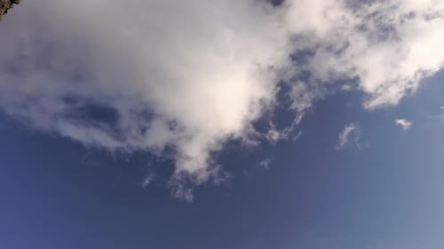 Blue Sky with White Clouds Passing By