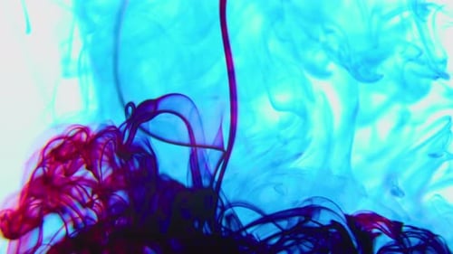 Vibrant Blue and Purple Ink Swirling Abstractly