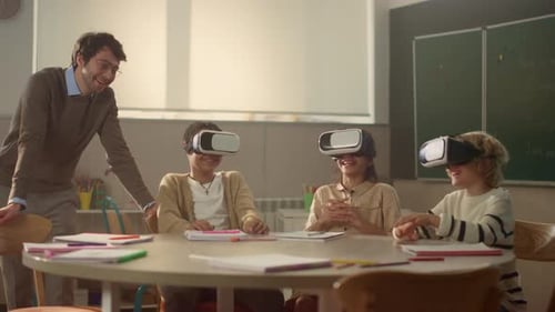 Teacher Helping Children Use Virtual Reality Headsets