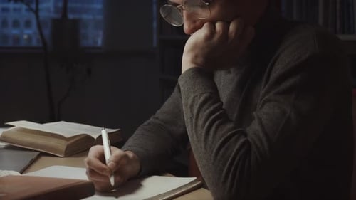 Education Stock Footage 4 K Ultra Hd Clips A Man Using Writing On The Notebook
