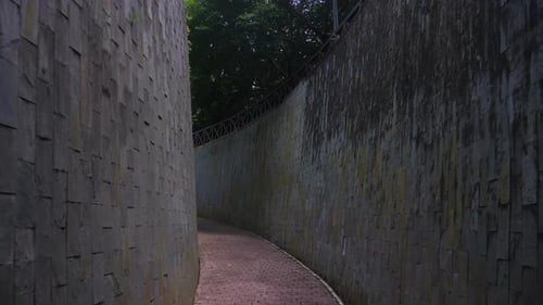 Curved Tunnel Between High Textured Walls