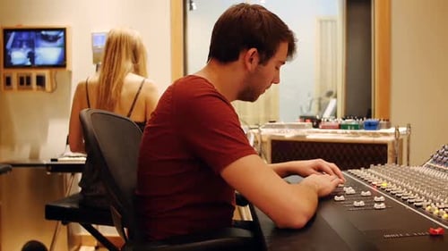 Student mixing music in the studio