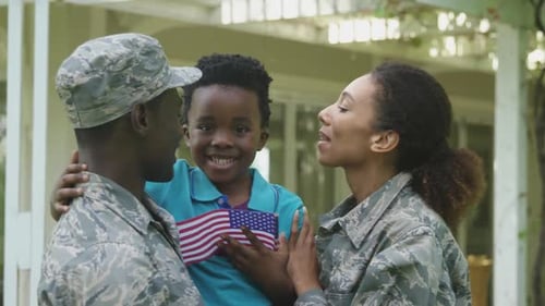 Happy Military Family Together Holding American Flag