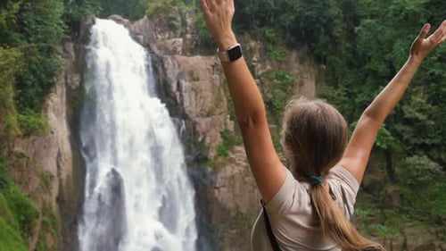 Back View of Female Tourist Enjoying Nature and Life