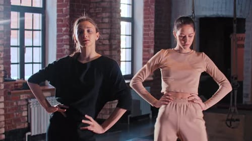 Young Adults Stretching in an Urban Fitness Studio