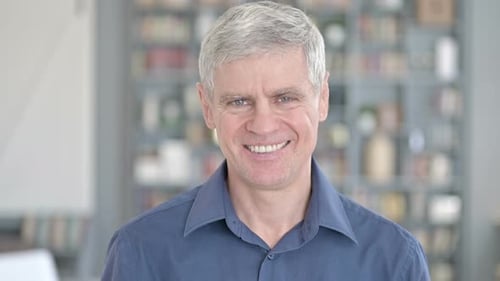 Gray Haired Man Smiling at the Camera