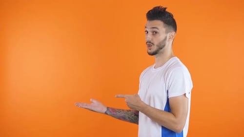 Young Adult Man Gesturing to the Side