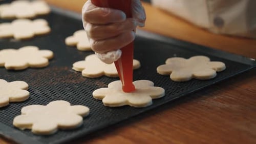 Confectioner makes pastries in the kitchen
