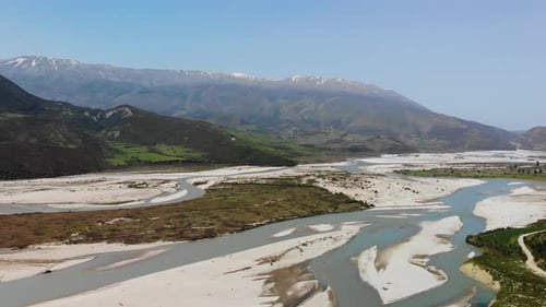 Aerial Drone Footage View Flight Over Mountain with Forests Fields and River in Sunrise Soft Light