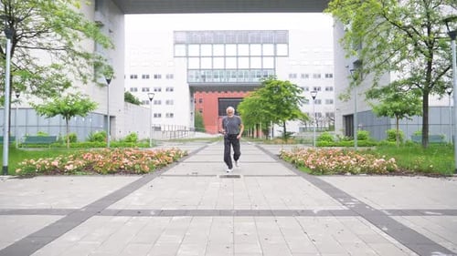 Senior man jogging in city