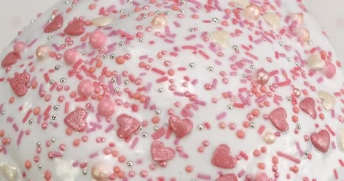 Festive Cake Decoration with Pink and Silver Sprinkles
