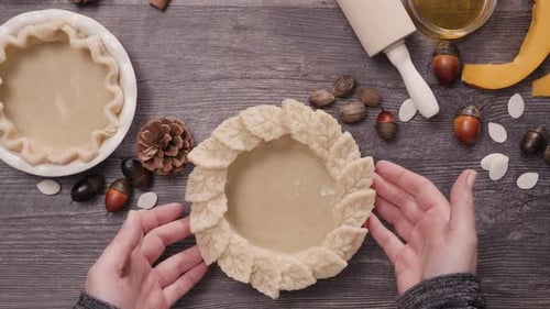 Preparing pie crusts for mini pumpkin pies.