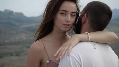 Romantic Couple Embracing in the Mountains