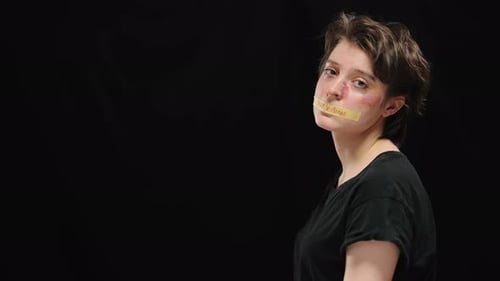 Woman with Bruises and Tape Over Mouth