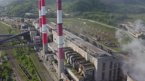 Aerial View of the Pipes of a Coal Power Plant and Cooling Tower