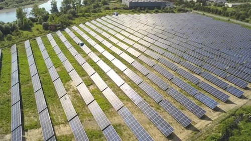 Aerial view of solar power plant field. Electrical photovoltaic panels for producing clean ecologic
