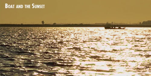 Boat Silhouetted in Golden Light at Sunset