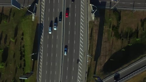 Top View Cars Driving on Highway Road. Car Traffic on Freeway Interchange