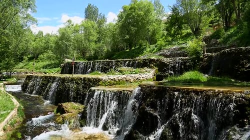 Beautiful Waterfalls Cascading Through Forest Landscape