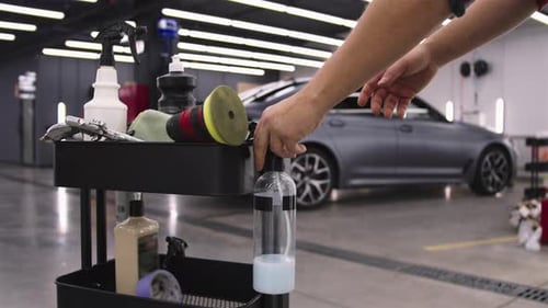 Close Up of Car Detailer Spraying Cleaner